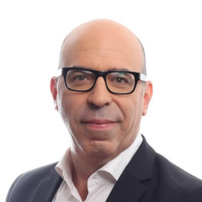 Ron Halpern, Mprest. A middle-aged man with glasses, a bald head, and light skin wearing a white shirt and dark suit jacket, posing and smiling slightly against a plain white background.